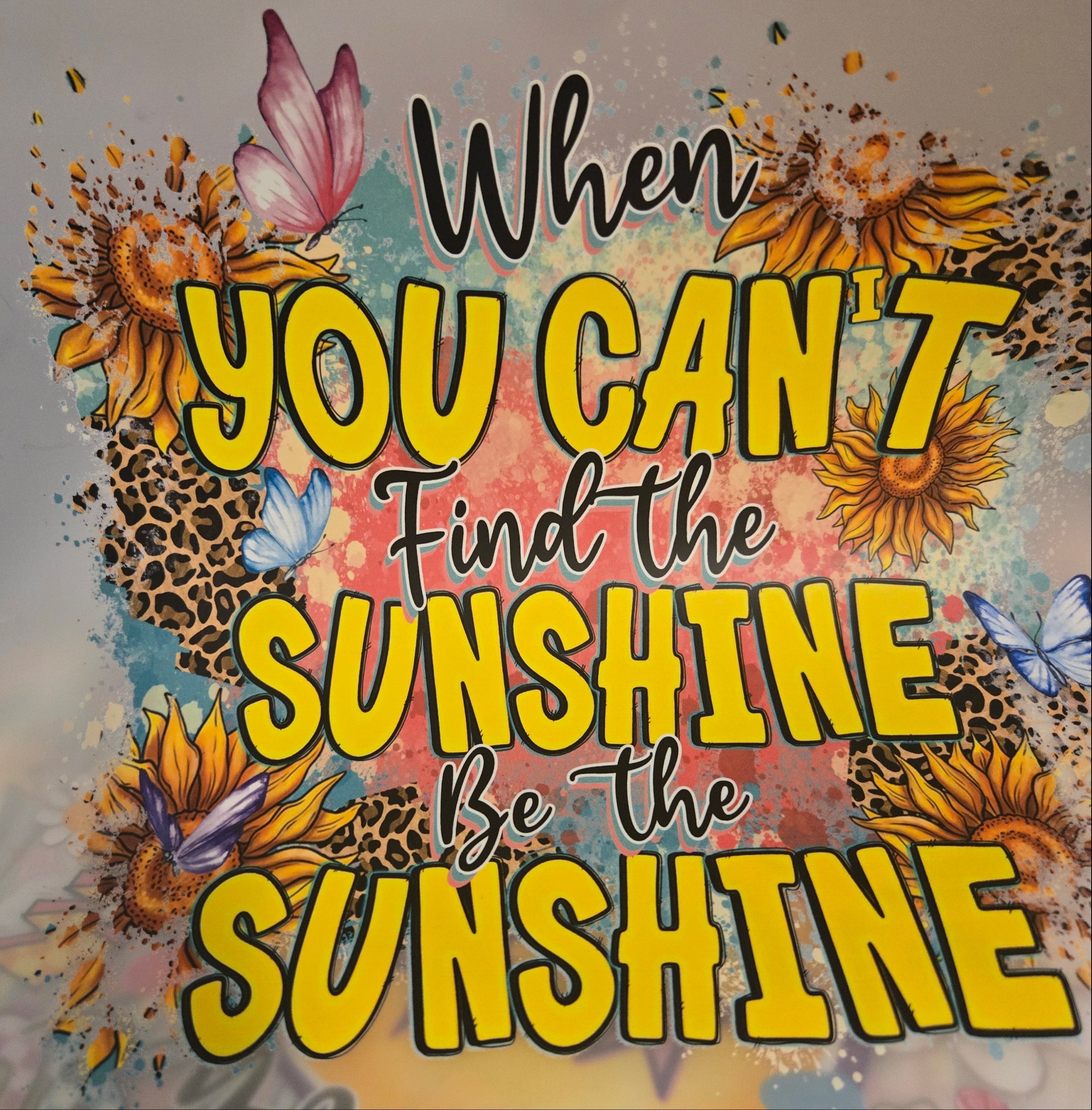 Colorful poster with motivational quote and floral designs